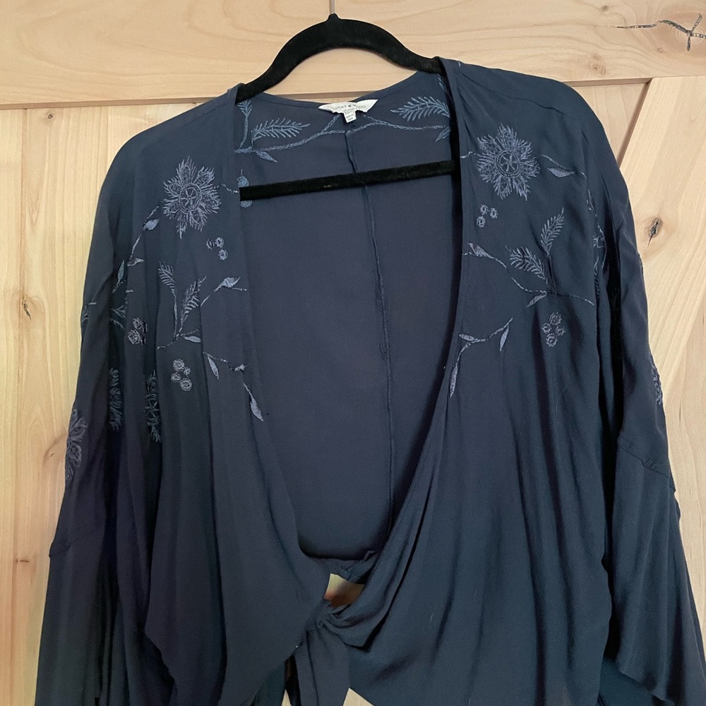 Lucky Brand wrap shirt. Bluish green color with floral embroidery detail.